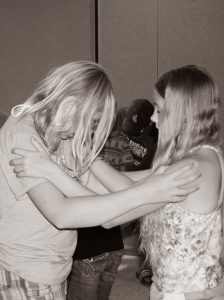 girls praying for each other